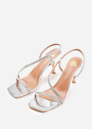 IVY CRYSTAL CROSS FOOT STRAP MID HEELS IN SILVER METALLIC